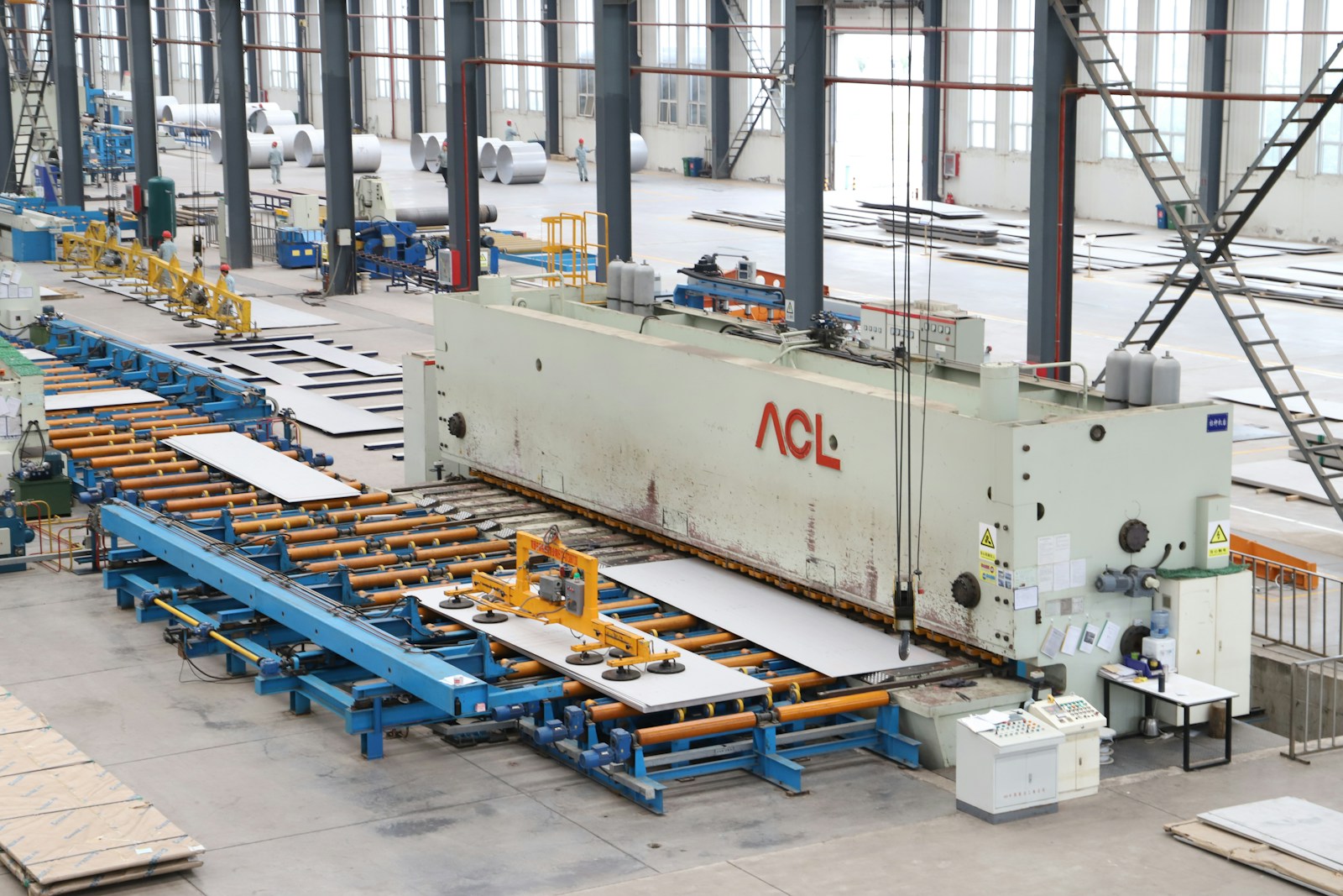 Large-scale industrial machinery in a factory serving textiles, pharma, packaging, and other sectors