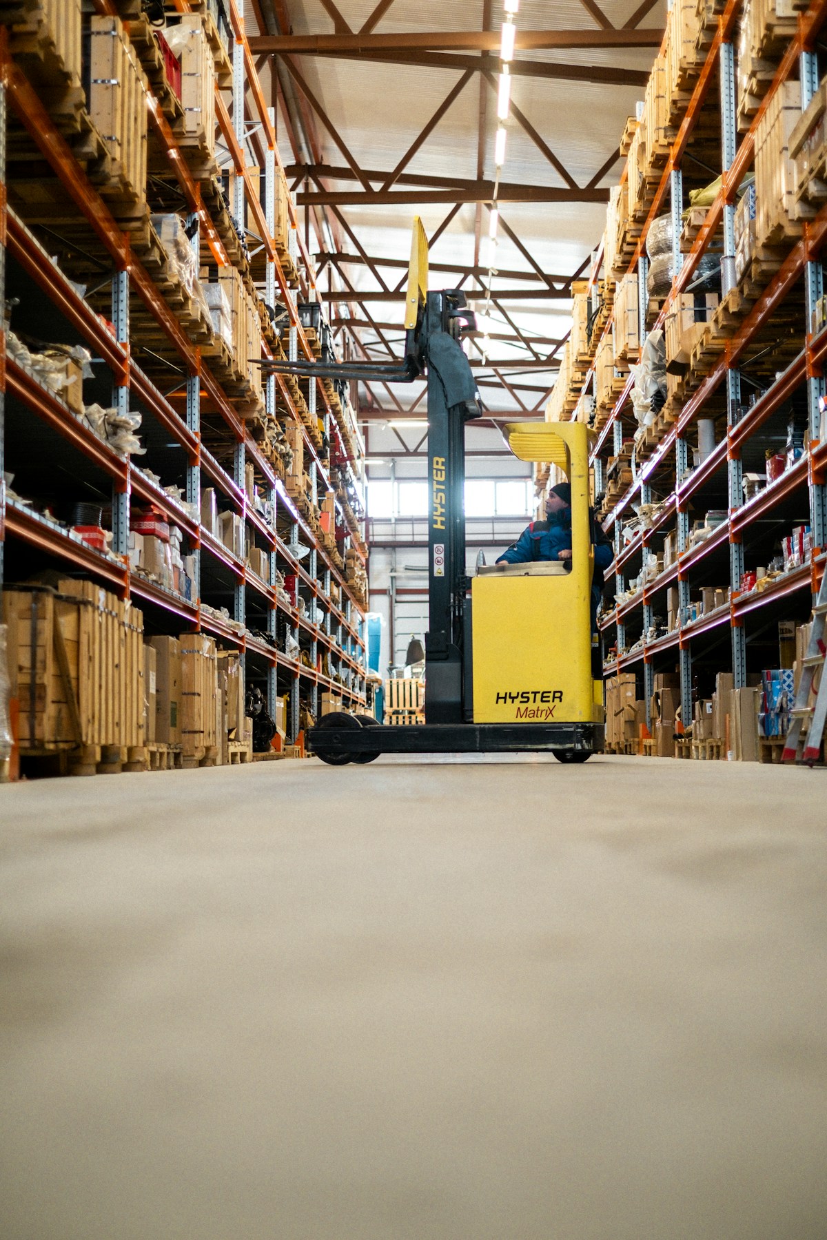 Warehouse and forklift with pallets — sourcing and logistics for automation components