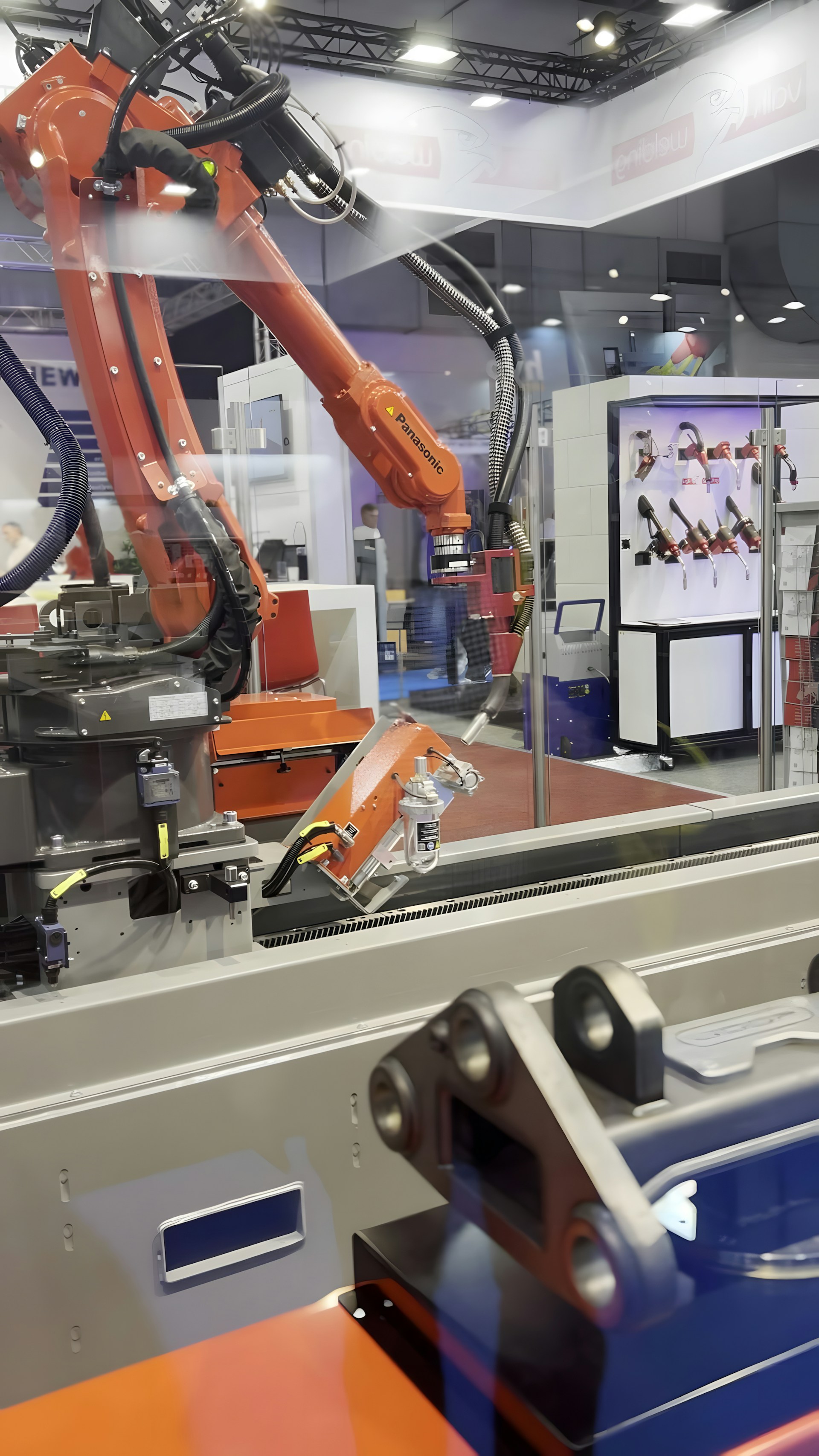 Industrial robot arm working inside a manufacturing facility
