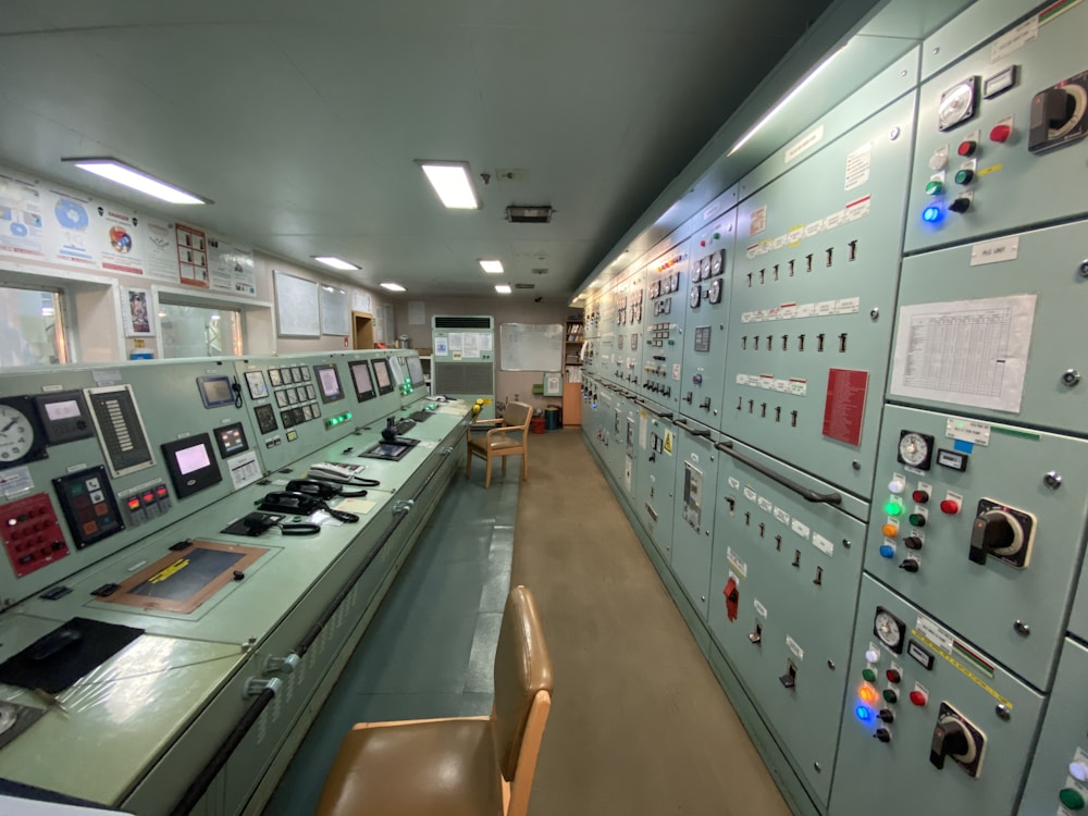 Control room with consoles and displays for plant-wide SCADA monitoring and supervision